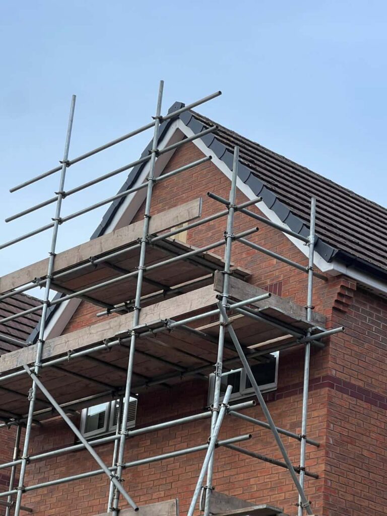 This is a photo of a roof which has just been repaired. There is a scaffold located at the gable end for access onto the roof. Works carried out by LJ Roofing Faringdon